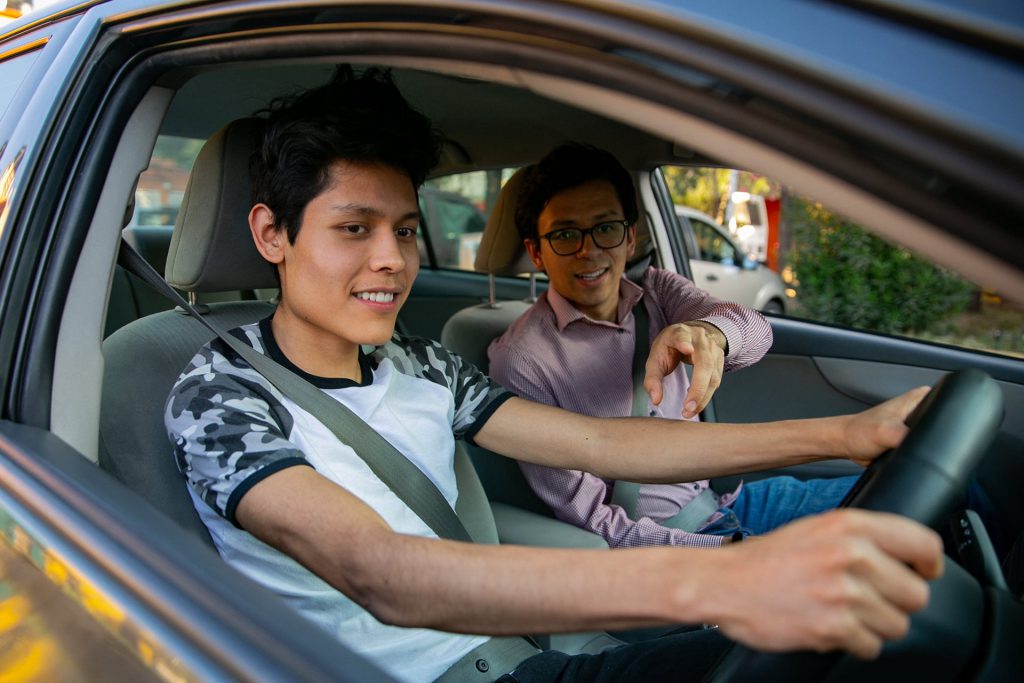 learner driving car with instructor